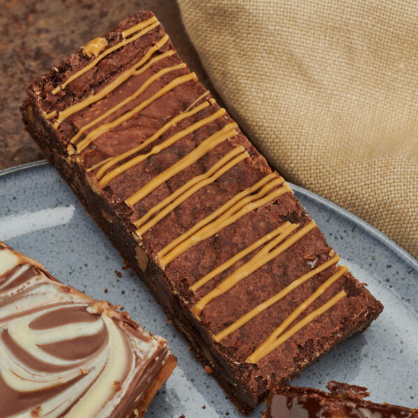 Chocolate brownie with caramel drizzle on plate